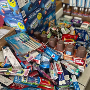 A table full of different types of toothpaste.
